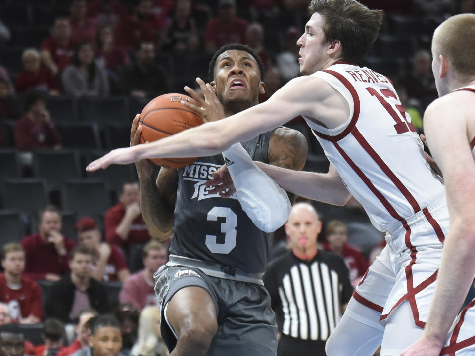 Mississippi State guard D.J. Stewart Jr. (3) takes a foul from Oklahoma guard Austin Reaves (12) during the second half of an NCAA college basketball game in Oklahoma City, Saturday, Jan. 25, 2020. (AP Photo/Kyle Phillips)