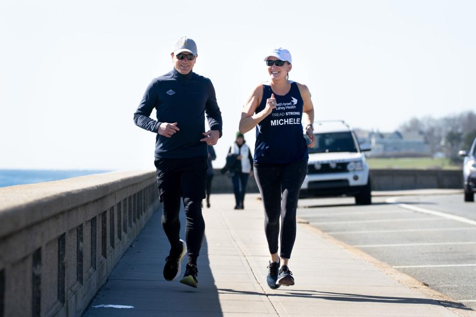 Jim and Michele Gilbert, who will run the Boston Marathon with their daughters, train in Narragansett.