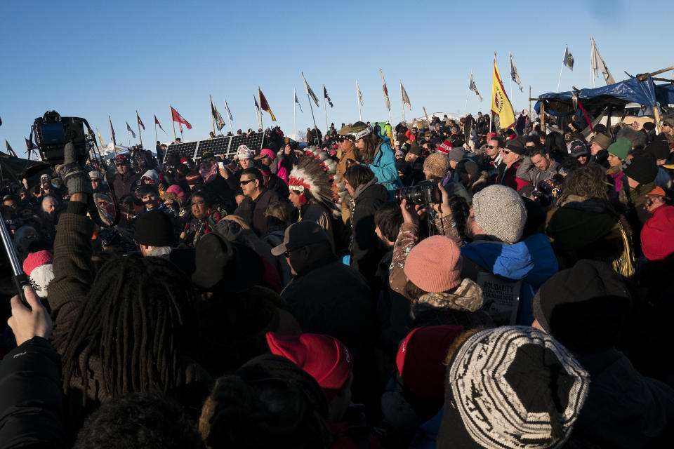 Thousands gather in the main area of the Oceti Sakowin campground to celebrate after the Army Corps of Engineers announced they will not be granting a drilling permit.