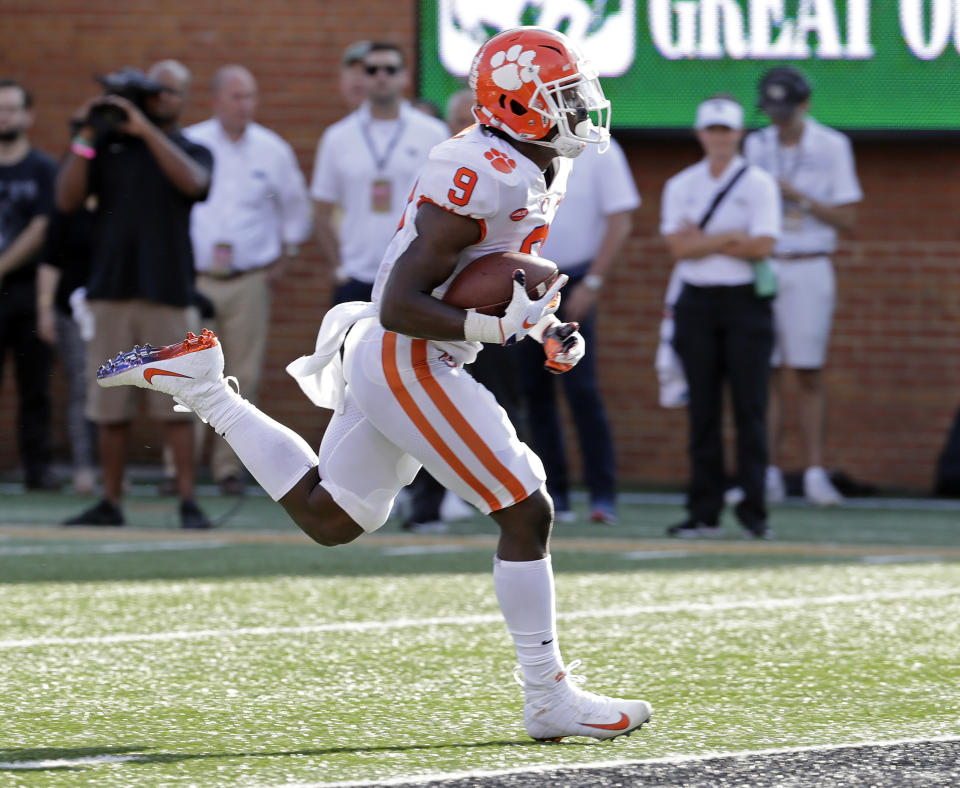 Clemson's Travis Etienne (9) runs for a touchdown against Wake Forest during the first half of an NCAA college football game in Charlotte, N.C., Saturday, Oct. 6, 2018. (AP Photo/Chuck Burton)