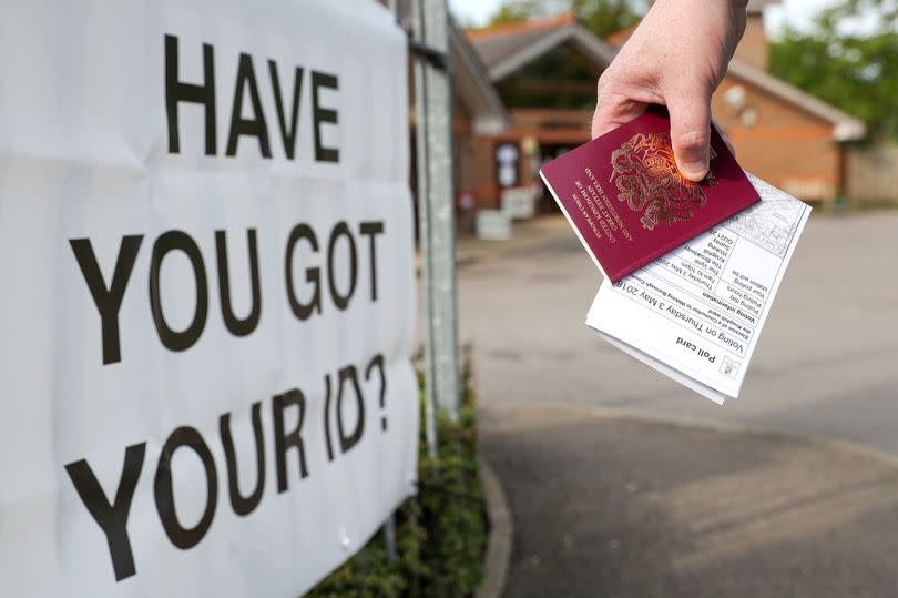 A voter carries his passport along with his poll card, as he makes his way to vote at The Vyne polling station in Knaphill, part of the Woking borough, which one of five councils working with Cabinet Office to trial the use of ID in polling stations.  PRESS ASSOCIATION Photo. Picture date: Thursday May 3, 2018. See PA story POLITICS Election. Photo credit should read: Andrew Matthews/PA Wire