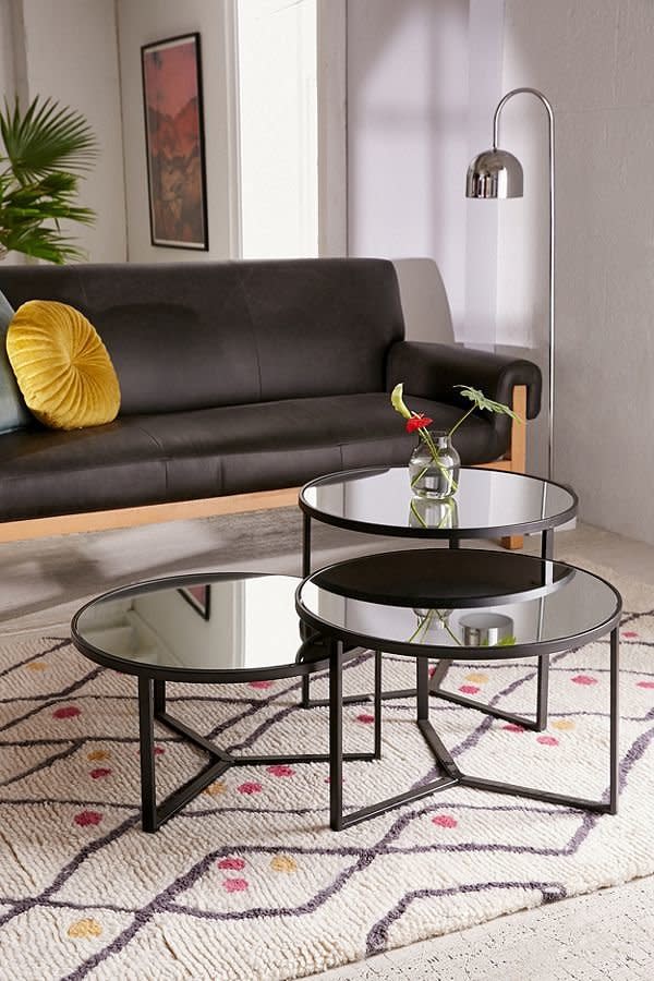 <a href="https://www.urbanoutfitters.com/shop/elliot-mirrored-coffee-table?category=furniture&amp;color=001&amp;quantity=1&amp;size=S&amp;type=REGULAR" target="_blank">These lacquered metal coffee tables</a> come separately in three different sizes so you can mix and match according to what best fits your space.