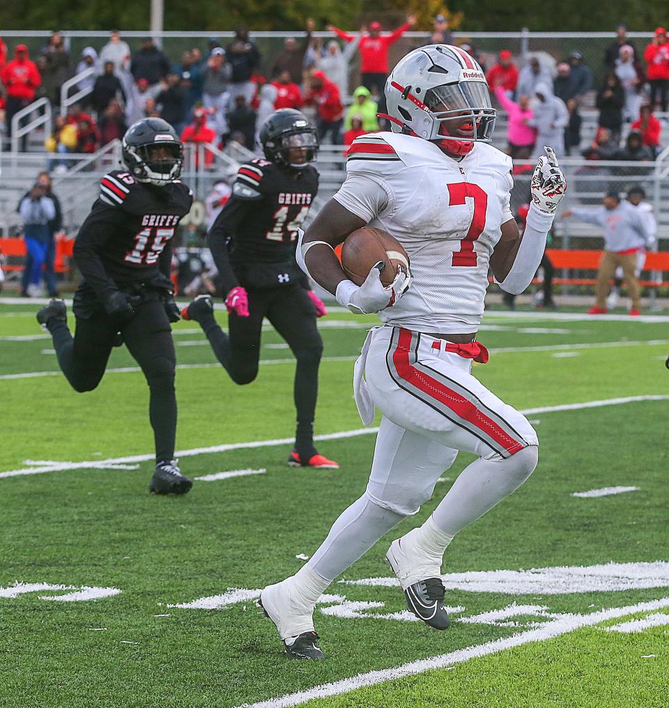 East running back Ziaire Stevens outruns two Buchtel defenders during a second-quarter 69-yard touchdown run Saturday in Akron.
