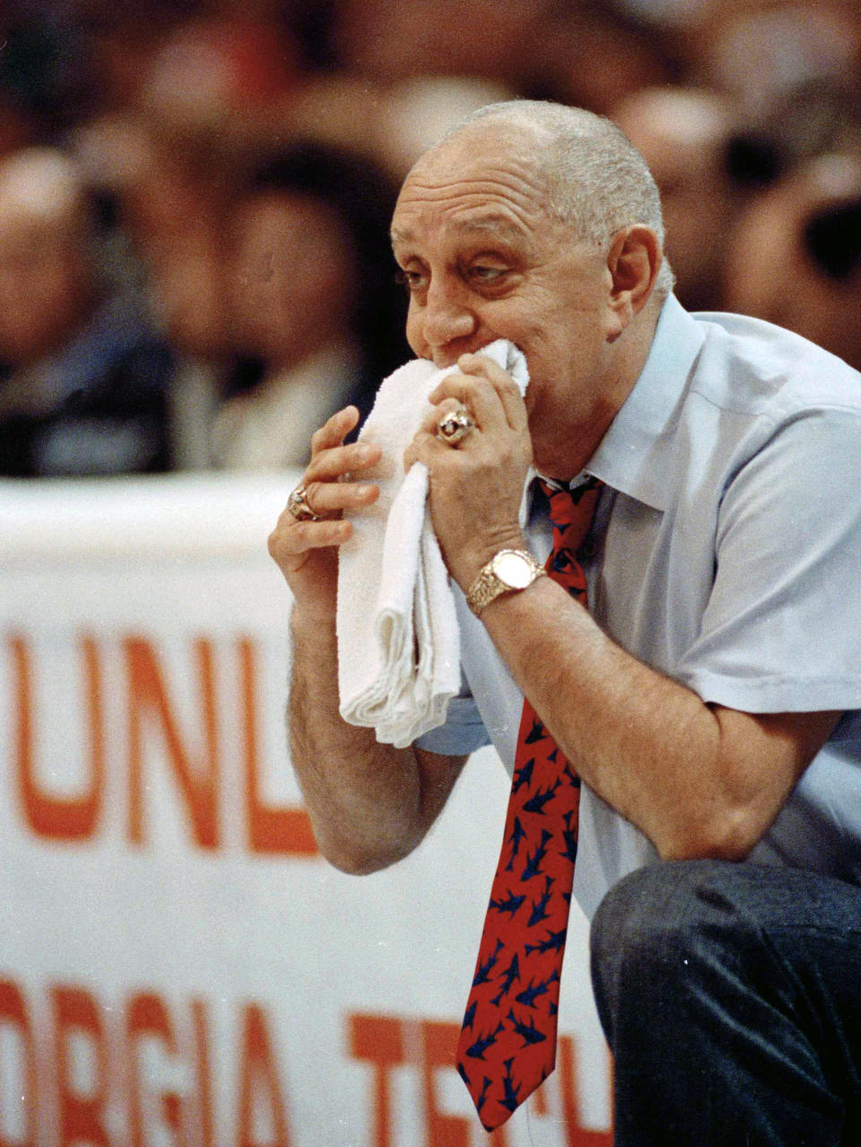 FILE - UNLV coach Jerry Tarkanian chews on his towel while watching his team play Duke in the championship game of the NCAA college basketball Final Four in Denver, April 2, 1990. (AP Photo/Ed Reinke, FIle)