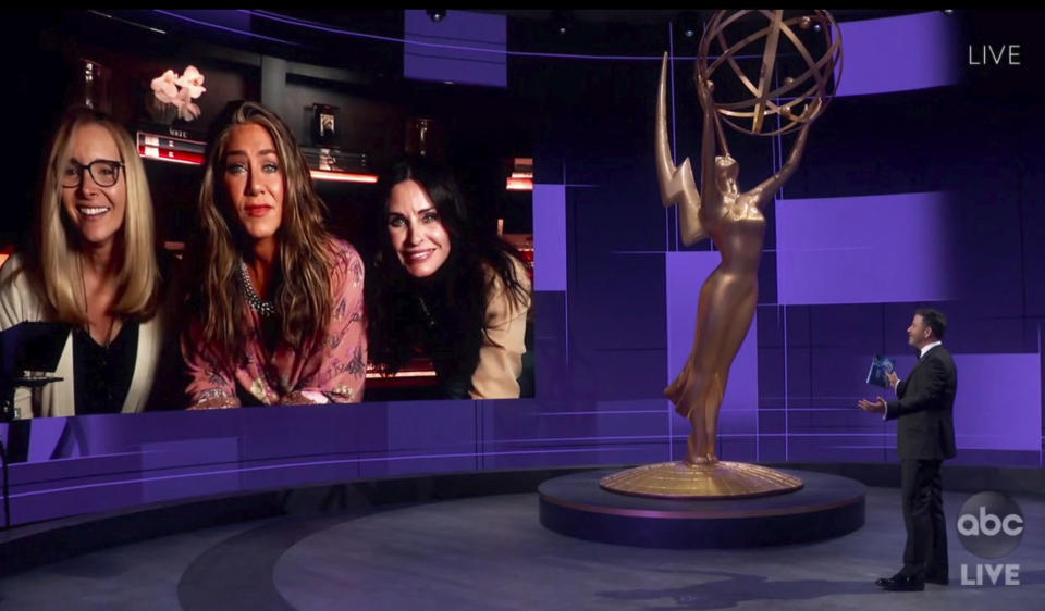 In this video grab captured on Sept. 20, 2020, courtesy of the Academy of Television Arts & Sciences and ABC Entertainment, Jimmy Kimmel, right, speaks with actors, from left, Lisa Kudrow, Jennifer Aniston and Courteney Cox during the 72nd Emmy Awards broadcast. (The Television Academy and ABC Entertainment via AP)