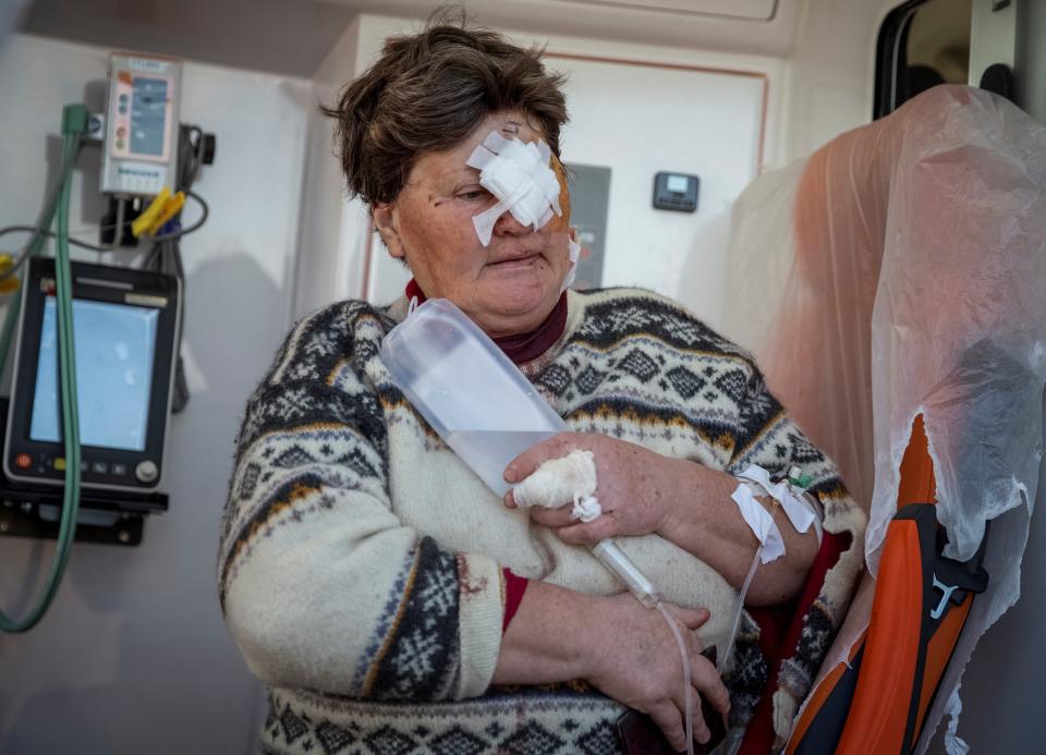 A local woman is taken to hospital after being wounded in Berislav (Reuters)