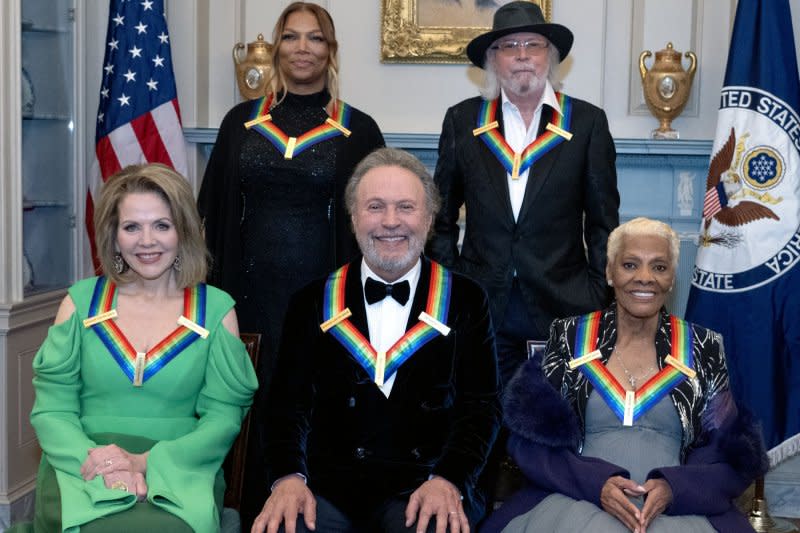 2023 Kennedy Center honorees pose for a group photo following the Medallion Ceremony of the Kennedy Center Honors at the Department of State in Washington on Saturday. Left to right, front: Renee Fleming, Billy Crystal and Dionne Warwick. Left to right, back: Queen Latifah and Barry Gibb. Photo by Ron Sachs/UPI