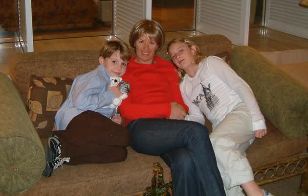 Lisa Hayden wearing one of her wigs, with her two children. Photo: Supplied