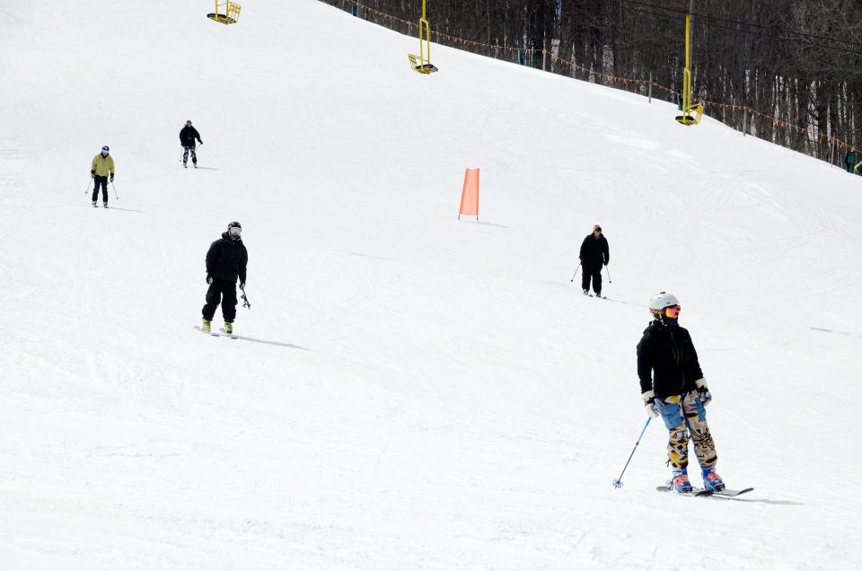 Skiers head down the slope at Nub's Nob in Harbor Springs.