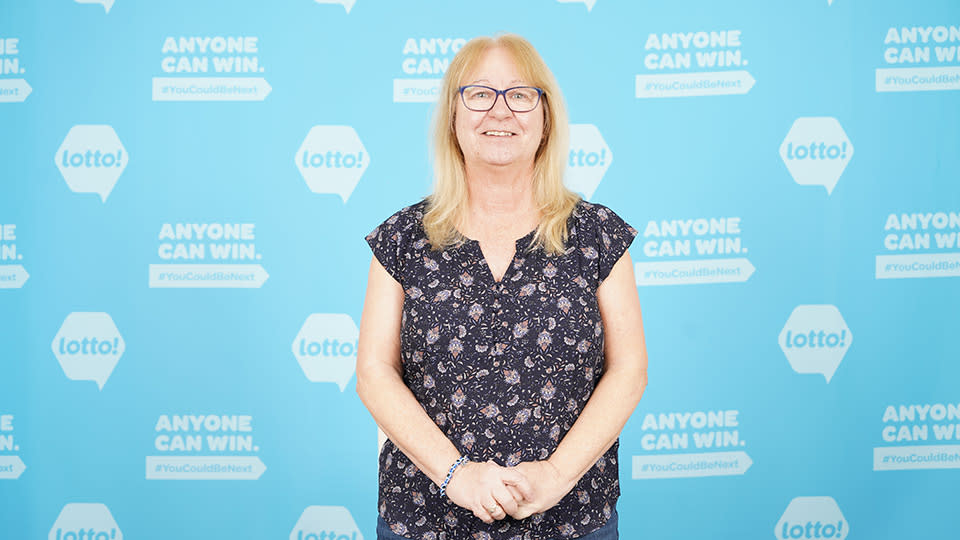 Susan Hoce poses after winning a $1 million lottery jackpot. 