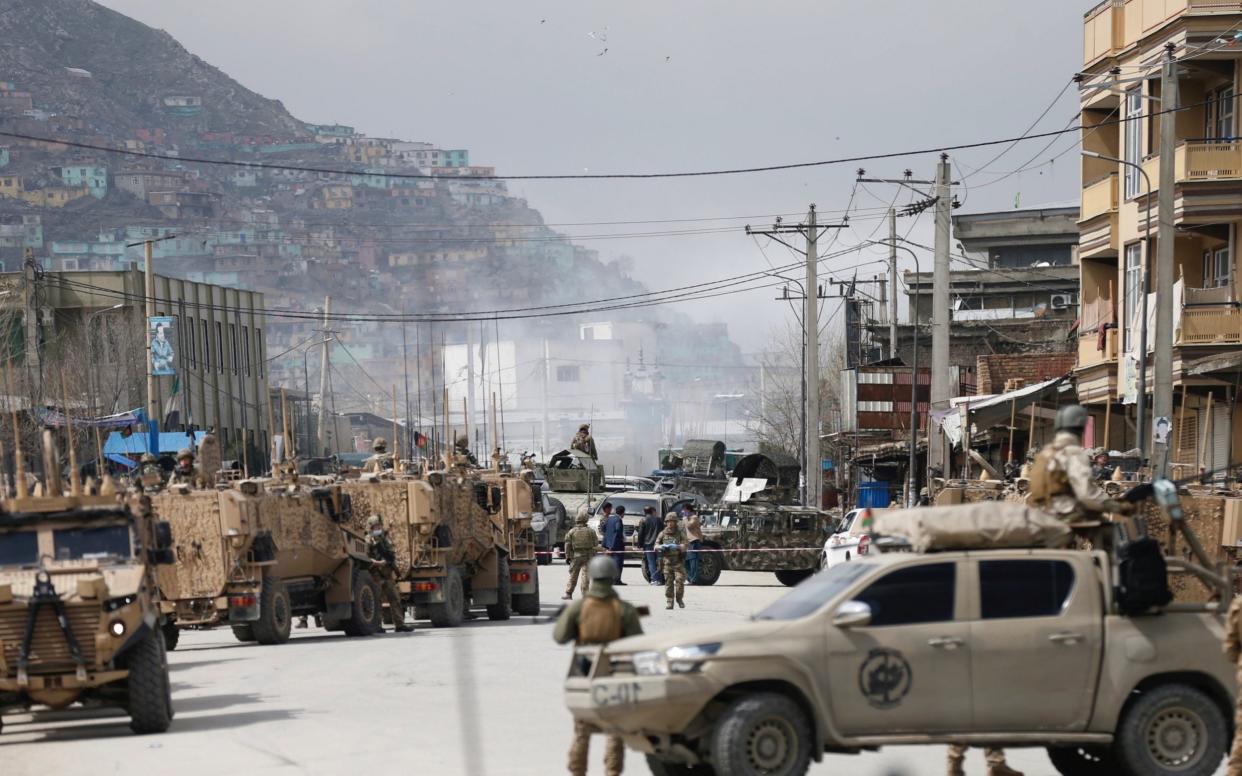 Afghan security forces inspect near the site of an attack in Kabul, Afghanistan March 25, 2020.REUTERS/Mohammad Ismail - Reuters