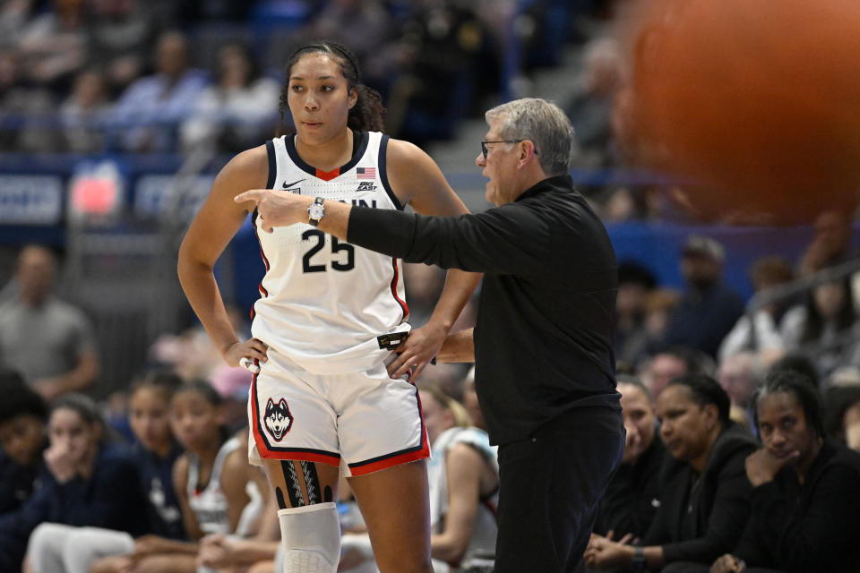 UConn head coach Geno Auriemma talks with UConn forward Ice Brady (25) in the first half of an NCAA college basketball game against Dayton, Wednesday, Nov. 8, 2023, in Hartford, Conn. (AP Photo/Jessica Hill)