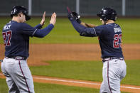 Atlanta Braves' Adam Duvall (23) is congratulated by Austin Riley (27) after his two-run home run off Boston Red Sox pitcher Mike Kickham during the second inning of a baseball game Wednesday Sept. 2, 2020, in Boston. (AP Photo/Charles Krupa)