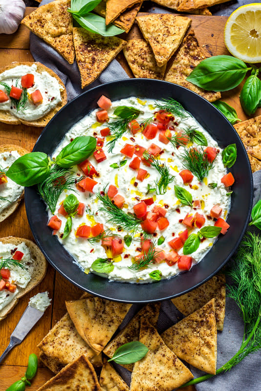 <p>Host the Toast</p><p>This simple, creamy dip is whipped up fluffy, deliciously tangy, flavorful, and always a crowd-pleaser.</p><p><strong>Get the recipe: <a href="https://hostthetoast.com/garlicky-feta-dip/" rel="nofollow noopener" target="_blank" data-ylk="slk:Garlicky Feta Dip;elm:context_link;itc:0;sec:content-canvas" class="link rapid-noclick-resp">Garlicky Feta Dip</a></strong></p>