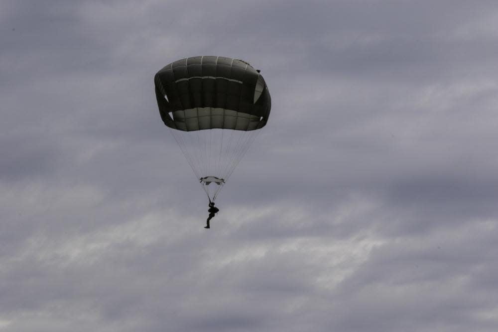 Paratroopers from the 3rd Brigade Combat Team, 82nd Airborne Division, conduct a rotary-wing airborne operation onto Sicily Drop Zone on May 5 at Fort Bragg. Paratroopers used personal protective equipment and proactive distancing to maintain personal readiness and prevent the spread of COVID-19.