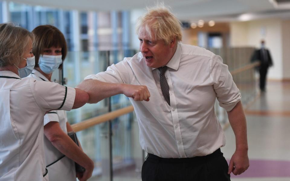 Boris Johnson during a visit to Hexham Hospital earlier this month – he was criticised for not wearing a mask - Getty