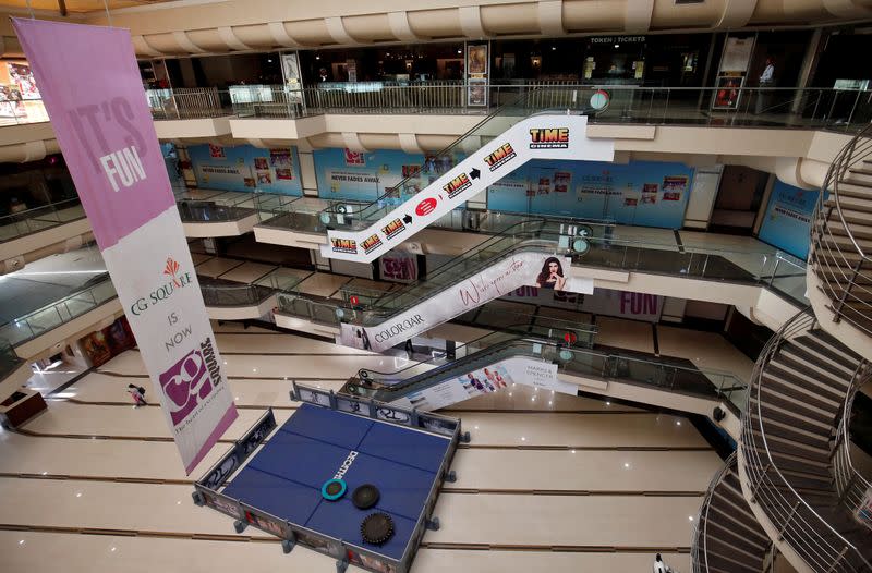 FILE PHOTO: A view of an empty shopping mall is seen after Gujarat state government banned public gatherings to avoid the spreading of the coronavirus, in Ahmedabad