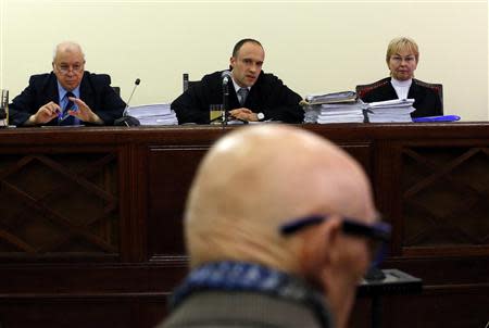 Former Communist Party leader Bela Biszku listens to judge Szabolcs Toth (top C) during his trial in Budapest March 18, 2014. REUTERS/Laszlo Balogh