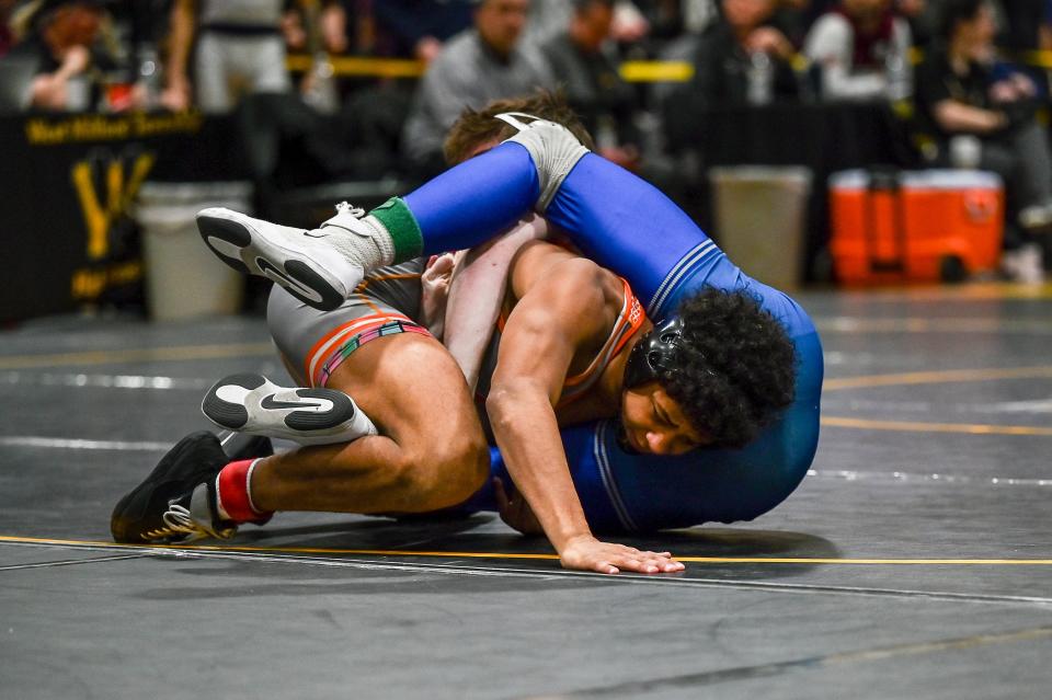 Dumont's Jeremy Quezada gets a shot in on Kittatinny's Reece Smith in the Region 1 wrestling semifinal at 150 pounds. February 24, 2024 at West Milford High School.