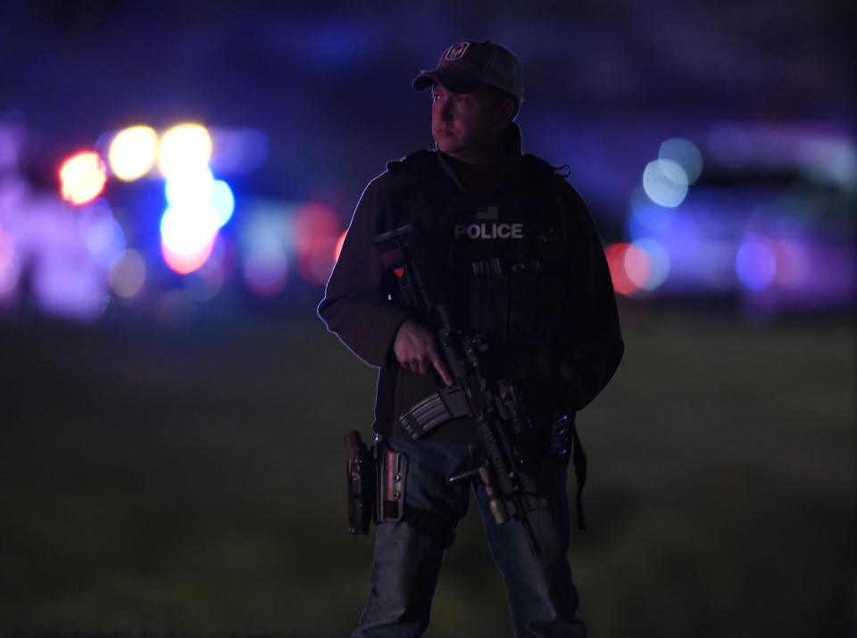 <p>A police officer stands guard near the intersection of Grant St. and 98th Ave during a shooting investigation at a Walmart super center, Nov. 1, 2017 in Thornton, Colo. (Photo: Andy Cross/The Denver Post via Getty Images) </p>