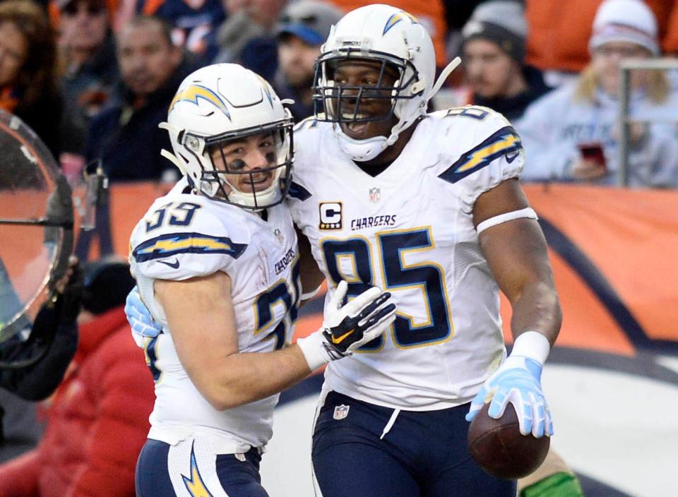 Chargers tight end Antonio Gates (85) celebrates his third-quarter TD reception with running back Danny Woodhead against the Broncos, Jan. 3, 2016, in Denver.