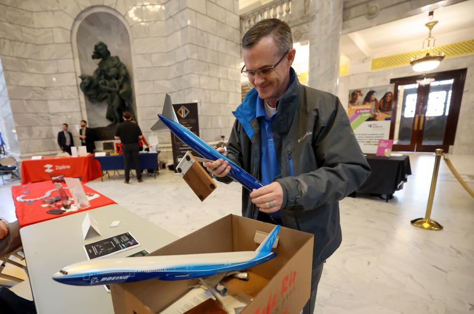 George Davidson, Boeing senior material management operations leader, puts Boeing model planes away at the end of Utah Aerospace and Defense Day on Capitol Hill at the Capitol in Salt Lake City on Thursday, Jan. 25, 2024. | Kristin Murphy, Deseret News