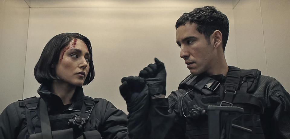 This image released by Netflix shows Golshifteh Farahani, left, and Adam Bessa in a scene from "Extraction 2." (Netflix via AP)