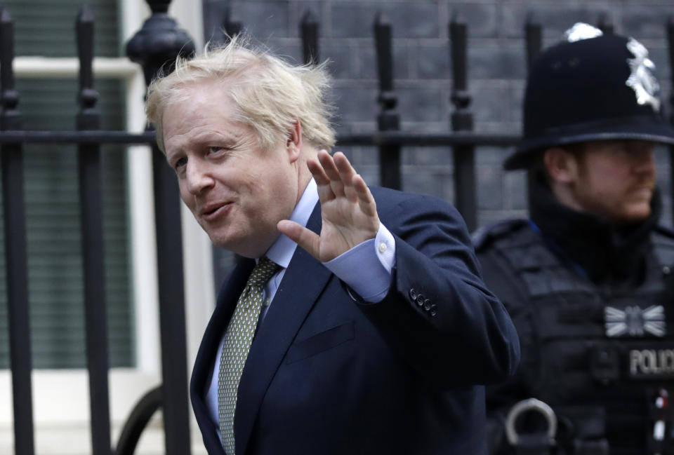 Britain's Prime Minister Boris Johnson returns to 10 Downing Street after meeting with Queen Elizabeth II at Buckingham Palace, London, on Friday, Dec. 13, 2019. Prime Minister Boris Johnson's Conservative Party has won a solid majority of seats in Britain's Parliament — a decisive outcome to a Brexit-dominated election that should allow Johnson to fulfil his plan to take the U.K. out of the European Union next month. (AP Photo/Matt Dunham)