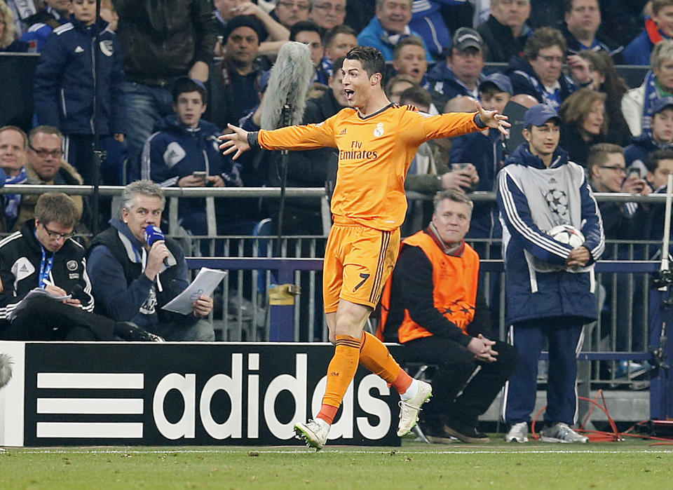 Real's Cristiano Ronaldo celebrates his side's third goal during the Champions League round of the last 16 first leg soccer match between Schalke 04 and Real Madrid in Gelsenkirchen, Germany, Wednesday, Feb.26,2014. (AP Photo/Frank Augstein)