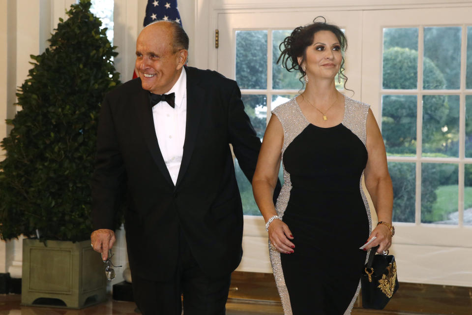 Rudy Giuliani, an attorney for President Donald Trump, and Maria Ryan arrive for a State Dinner with Australian Prime Minister Scott Morrison and President Donald Trump at the White House, Friday, Sept. 20, 2019, in Washington. (AP Photo/Patrick Semansky)