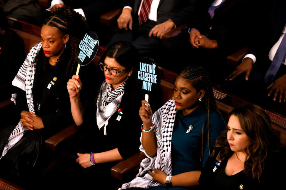 Reps. Rashida Tlaib and Cori Bush, progressive Democrats from Michigan and Missouri respectively, hold up signs calling for a Gaza ceasefire during Biden’s State of the Union.<span class="copyright">Julia Nikhinson—Bloomberg/Getty Images</span>