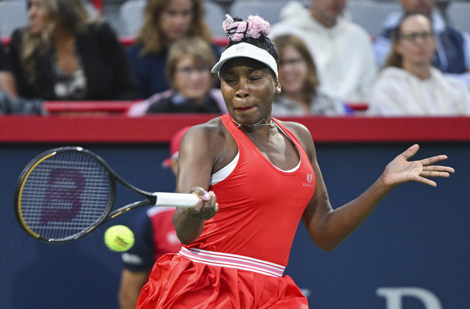 Venus Williams, of the United States, plays a shot during her women's first-round match against Madison Keys, also of the United States, at the National Bank Open tennis tournament in Montreal, Monday, Aug. 7, 2023. (Graham Hughes/The Canadian Press via AP)