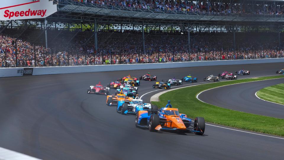 Scott Dixon leads the field in the 106th Indianapolis 500 on Sunday before a pit speed limit infraction left him 21st in a race he had dominated.