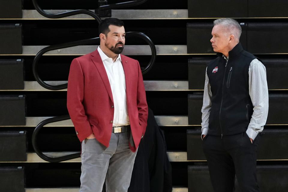 Jan 17, 2024; Columbus, OH, USA; Ohio State Buckeyes football coach Ryan Day talks to basketball coach Chris Holtmann prior to a press conference to name Ross Bjork the university’s new athletic director at the Covelli Center.