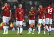 <p>Manchester United’s Wayne Rooney, second left celebrates with teammates after the end of the Europa League semifinal second leg soccer match between Manchester United and Celta Vigo at Old Trafford </p>