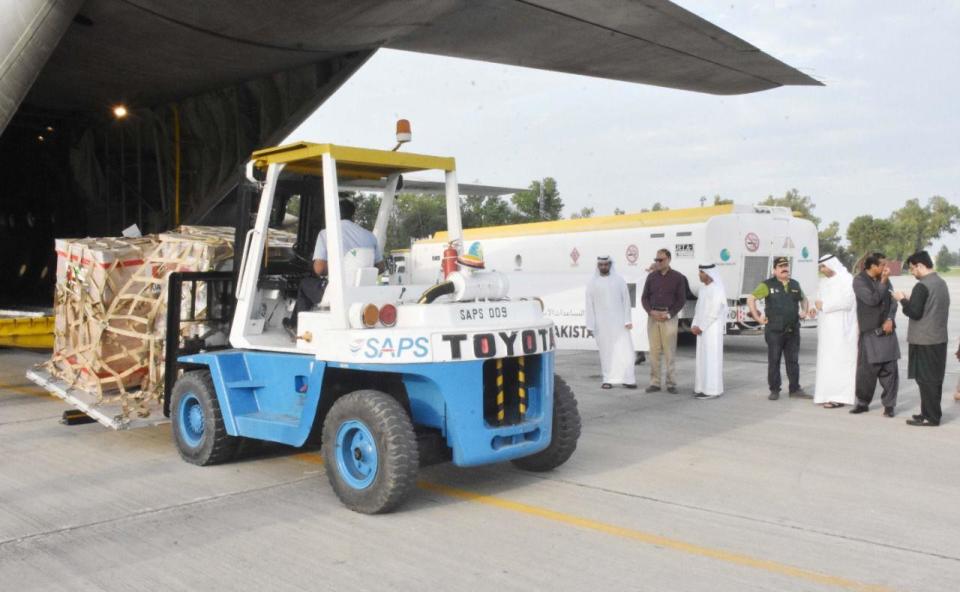 Humanitarian aid from the United Arab Emirates is offloaded at the Nur Khan Airbase, in Pakistan's Punjab province, August 29, 2022, to help victims of the flooding caused by a 