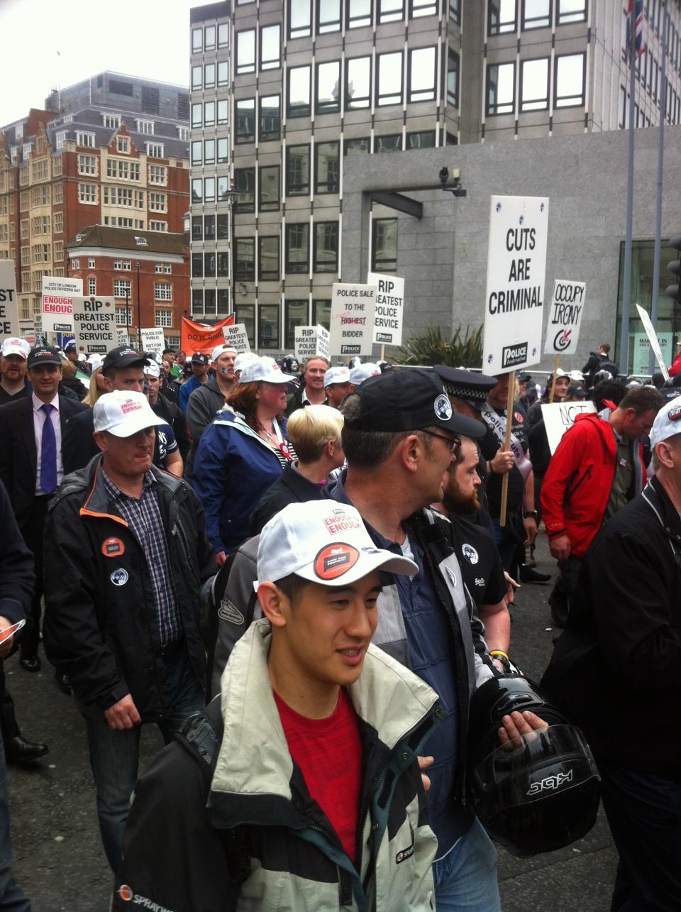 16,000 of those workers donned black caps to represent each officer expected to be lost by austerity measures.