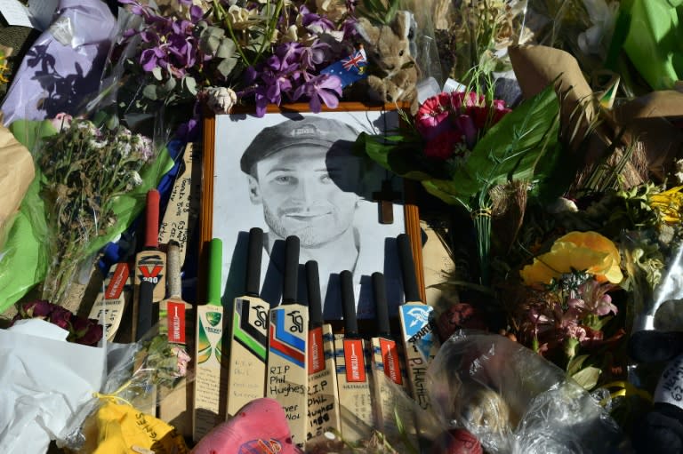 Bats and caps are left outside the Adelaide Oval stadium in a tribute to the late Phillip Hughes prior to the first day of play on the first Test match between Australia and India on December 9, 2014