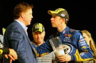 Brad Keselowski, driver of the #2 Miller Lite Dodge, talks with NASCAR chairman and CEO Brian France in Champions Victory Lane after winning the series championship and finishing in fifteenth place for the NASCAR Sprint Cup Series Ford EcoBoost 400 at Homestead-Miami Speedway on November 18, 2012 in Homestead, Florida. (Photo by Jared C. Tilton/Getty Images for NASCAR)