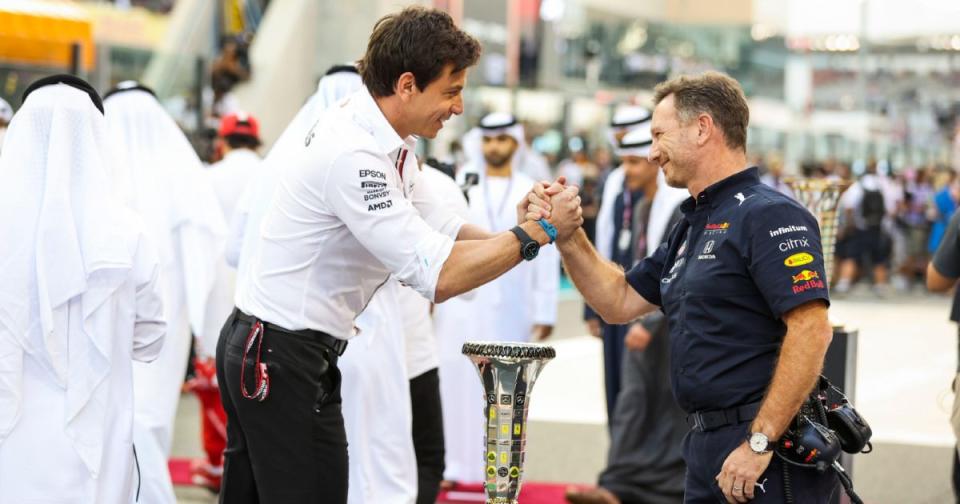 Mercedes' Toto Wolff and Red Bull's Christian Horner shake hands on the grid for the 2021 Abu Dhabi Grand Prix. Yas Marina, December 2021. Image credit: Alamy