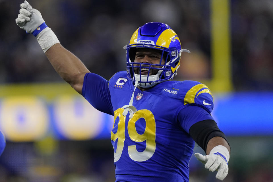 Los Angeles Rams defensive end Aaron Donald (99) celebrates during the first half of an NFL wild-card playoff football game against the Arizona Cardinals in Inglewood, Calif., Monday, Jan. 17, 2022. (AP Photo/Mark J. Terrill)