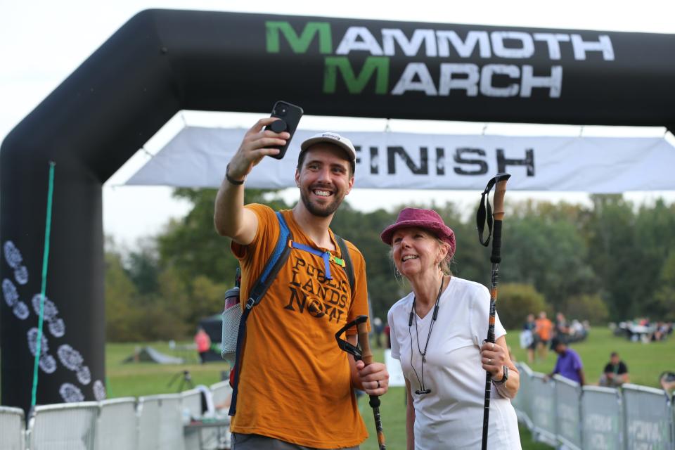 MammothMarch participants celebrate crossing the finish line at a past event.