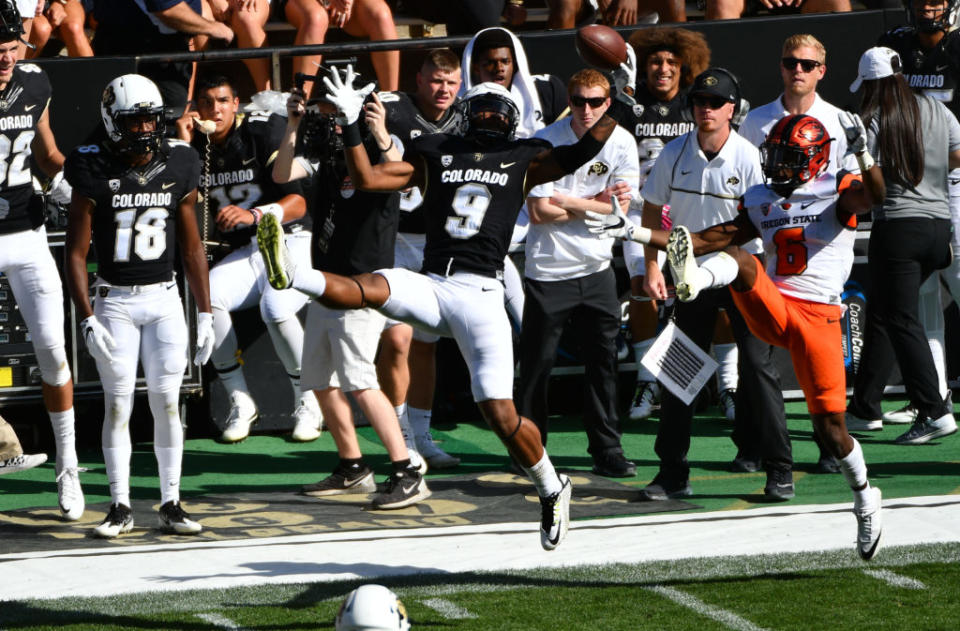 Oct 1, 2016; Boulder, CO, USA; Colorado Buffaloes defensive back Tedric Thompson (9) pulls in an interception intended for Oregon State Beavers wide receiver Victor Bolden Jr. (6) in the second half at Folsom Field. The Buffaloes defeated Beavers 47-6. Mandatory Credit: Ron Chenoy-USA TODAY Sports