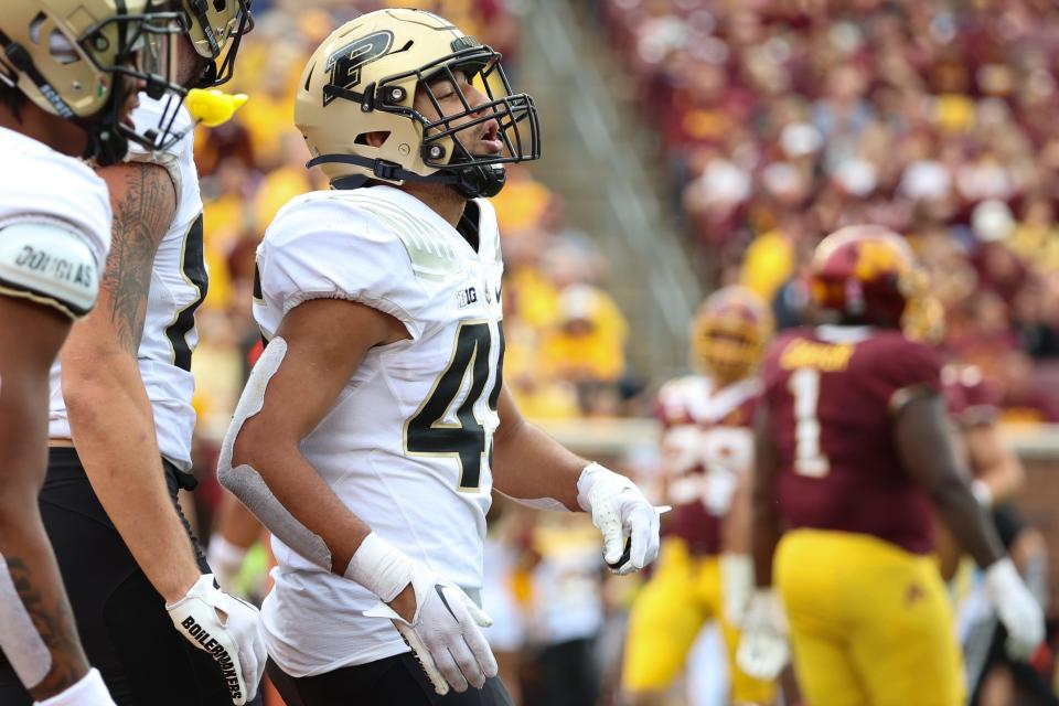 Oct 1, 2022; Minneapolis, Minnesota, USA; Purdue Boilermakers running back Devin Mockobee (45) celebrates after scoring a touchdown during the fourth quarter at Huntington Bank Stadium.