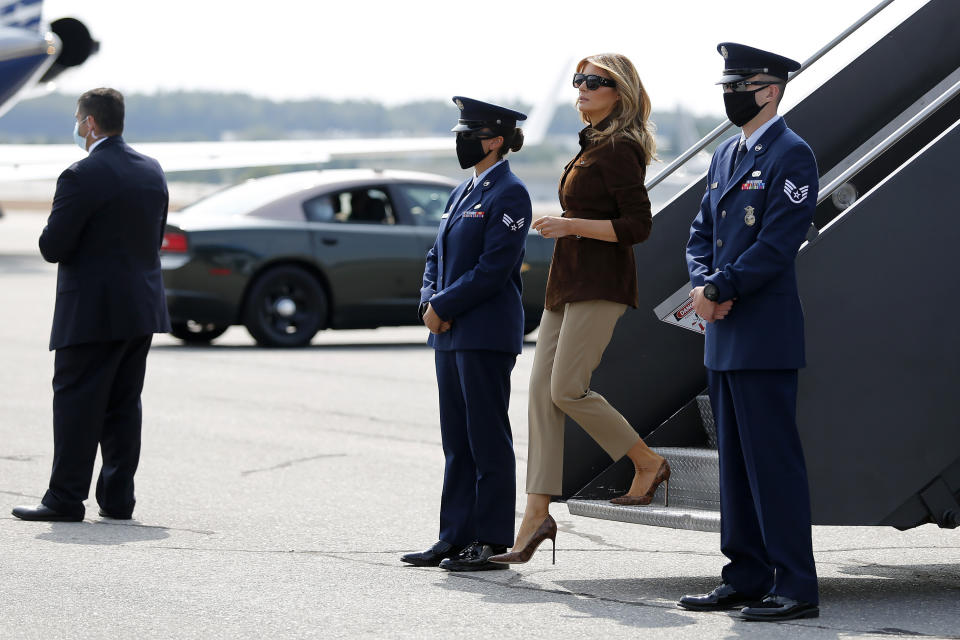 First lady Melania Trump steps onto the tarmac as she arrives at Manchester Regional Airport, Thursday, Sept. 17, 2020, in Manchester, N.H. (AP Photo/Mary Schwalm)