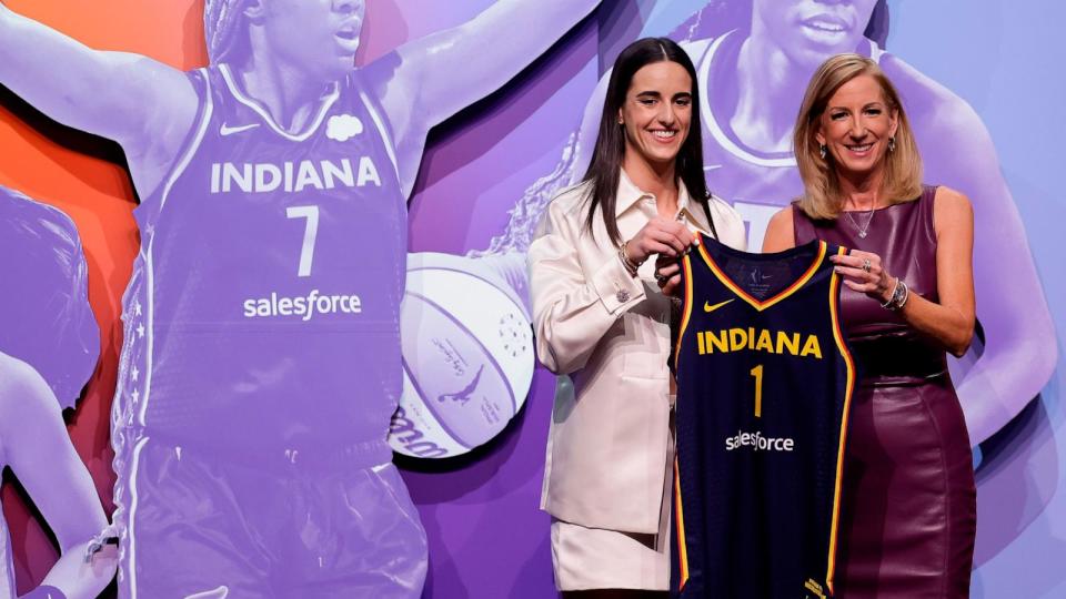 PHOTO: Iowa's Caitlyn Clark, left, poses for a photo with WNBA commissioner Cathy Engelbert after being selected first overall by the Indiana Fever during the first round of the WNBA basketball draft, April 15, 2024, in New York. (Adam Hunger/AP)