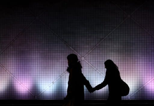 File photo shows a couple walking along a footpath in Hong Kong. Sex experts are urging Hong Kongers to strip off their reputation as some of the least active lovers in Asia to get more out of their sex lives and overcome challenges of privacy in a cramped city