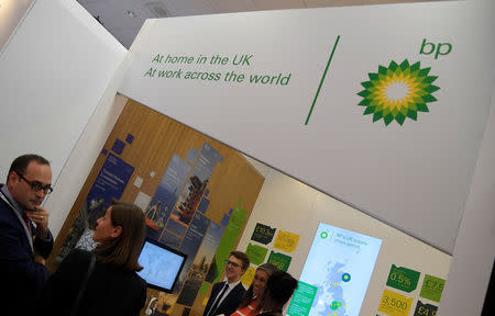 Attendees talk by the BP stand at the Labour Party Conference venue in Brighton, Britain, September 26, 2017. REUTERS/Toby Melville