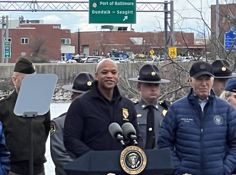 Maryland Gov. Wes Moore speaks from the lectern affixed with the presidential seal next to U.S. President Joe Biden, at right, outside the Maryland Transportation Authority Police headquarters in Dundalk on April 5, 2024.