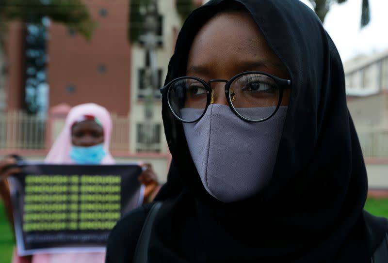 A protester takes part in a demonstration to raise awareness about sexual violence, in Abuja